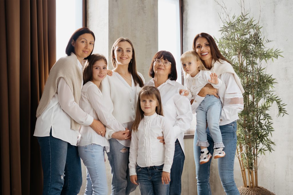 women of three generations posing at home
